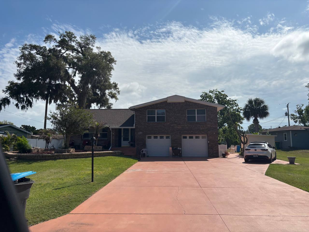 After: new architectural shingles on brick home in Volusia County