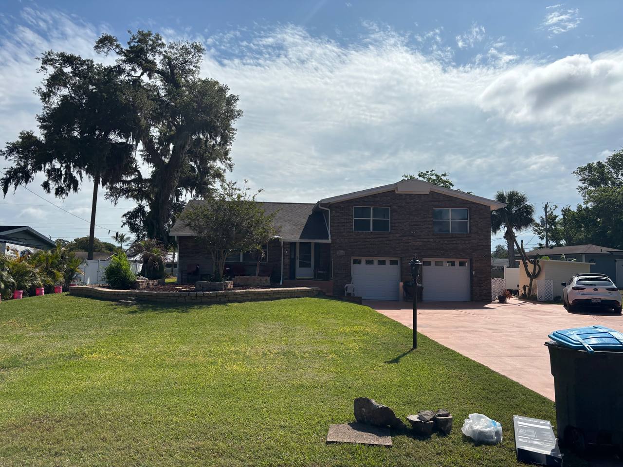 Before: worn roof on brick home in Volusia County